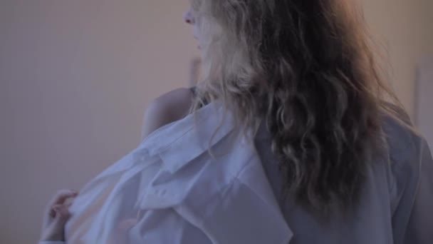 Sexy girl in a black bra and white shirt - Materiał filmowy, wideo
