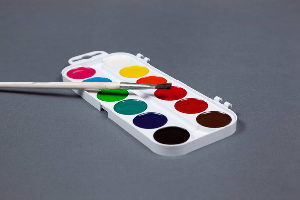 Palette of watercolor paints on a gray background - Foto, immagini