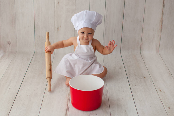 Little baby chef in apron. - Fotografie, Obrázek