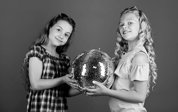 party goers. happy birthday. holiday celebration. dancing and having fun. small girl spend time together. friendship and sisterhood concept. small girls with disco ball. Real relaxation - Fotó, kép