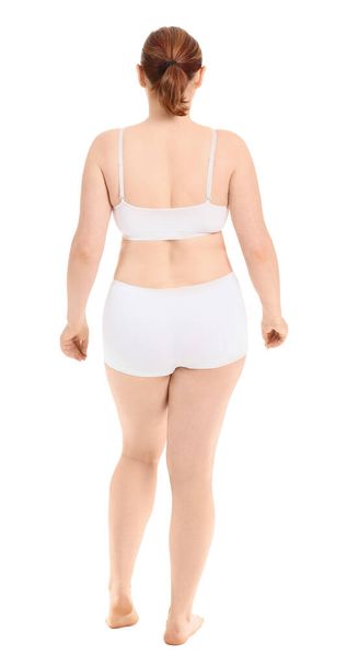 Overweight woman on white background. Weight loss concept - Fotoğraf, Görsel