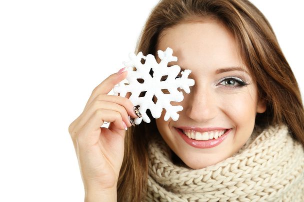 Beautiful smiling girl with Christmas snowflake isolated on white - Foto, imagen