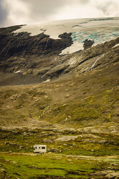 Camper in norwegian mountains. Camping on nature. Traveling, holidays and adventure concept. - 写真・画像