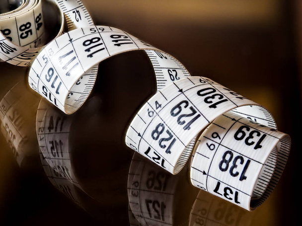 Tape measure, used by dressmakers and tailors to take measurements of the clothes to be made. - Photo, Image