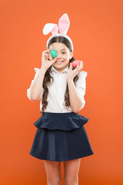 Easter eggs. Happy easter. Tradition of decorating eggs of all kinds. Small girl bunny ears. Kid on easter egg hunt. Adorable happy child hold eggs. Spring holiday. Little schoolgirl in rabbit ears - Fotoğraf, Görsel