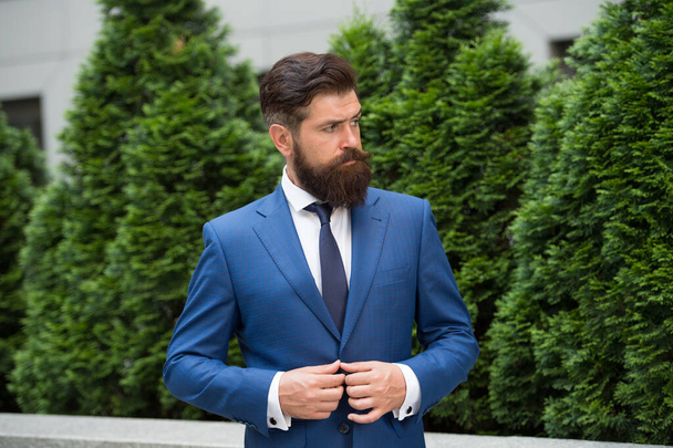 Successful entrepreneur. Businessman well groomed hairstyle. Business center. Business life. Man businessman classic style urban park background. Business man bearded wear perfect fashionable suit - Foto, imagen