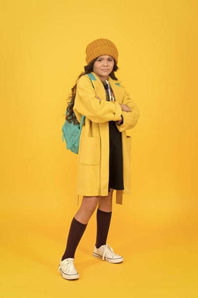 Fall outfit. Modern teen outfit concept. Outfit for daily school life. Feeling cool and stylish. Fall fashion. Little girl wearing stylish hat and coat. Schoolgirl fancy child. Aesthetics of clothes - Photo, image