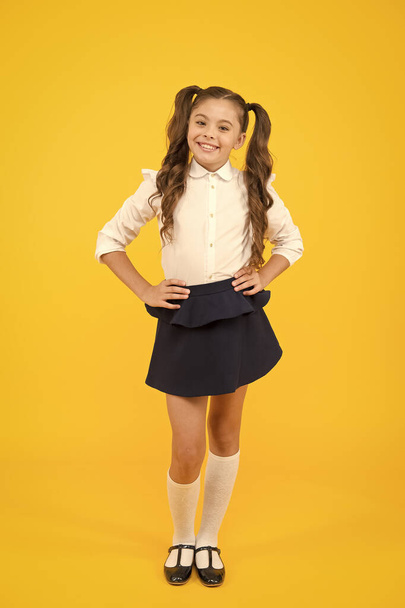 Student little kid. Emotional school girl. Successful graduation. Happy childrens day. Positive vibes. School life concept. Celebrate knowledge day. Girl pupil on yellow background. Back to school - Photo, image