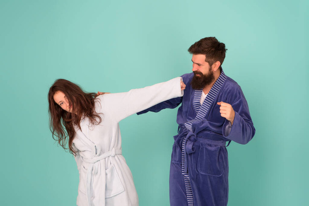 Advice relationships surviving quarantine. Morning routine. Couple sleepy faces domestic clothes. All day pajamas. Sleepy people blue background. Couple in love bathrobes. Drowsy and weak in morning - Photo, Image