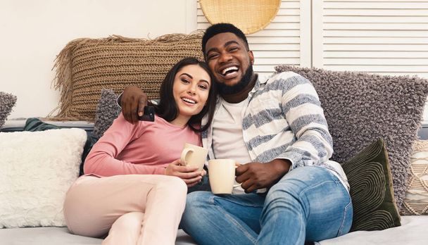 Glad multiracial millennial family resting at home - Photo, Image