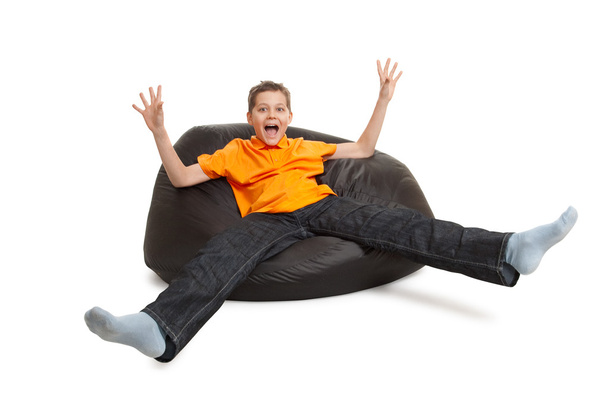 Young man on bean bag - Foto, afbeelding