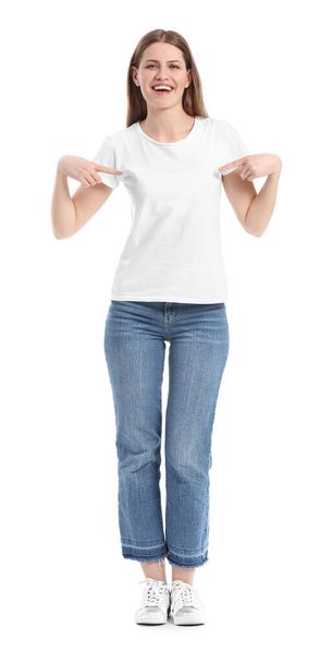 Young woman in stylish t-shirt on white background - Foto, imagen