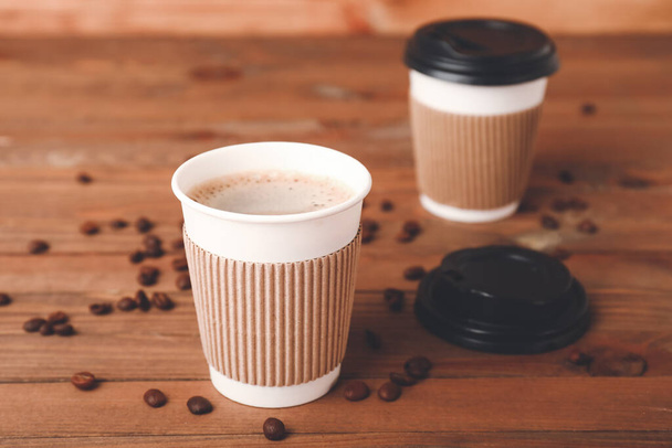 Takeaway coffee cups on wooden background - Photo, Image