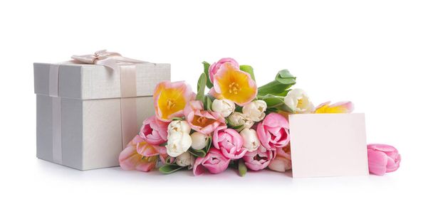 Gifts and beautiful flowers on white background - Фото, изображение