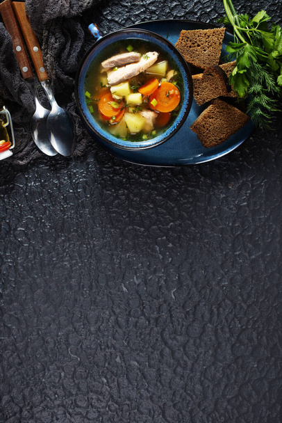 fish soup in bowl, fresh soup in blue bowl - Foto, afbeelding