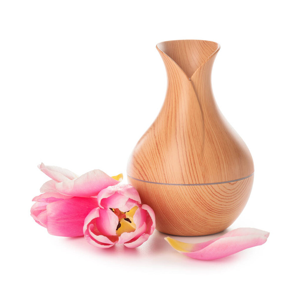 Aroma oil diffuser and flowers on white background - Photo, Image