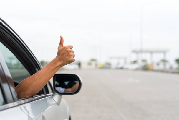 Male hand thumbs up in car - Photo, Image