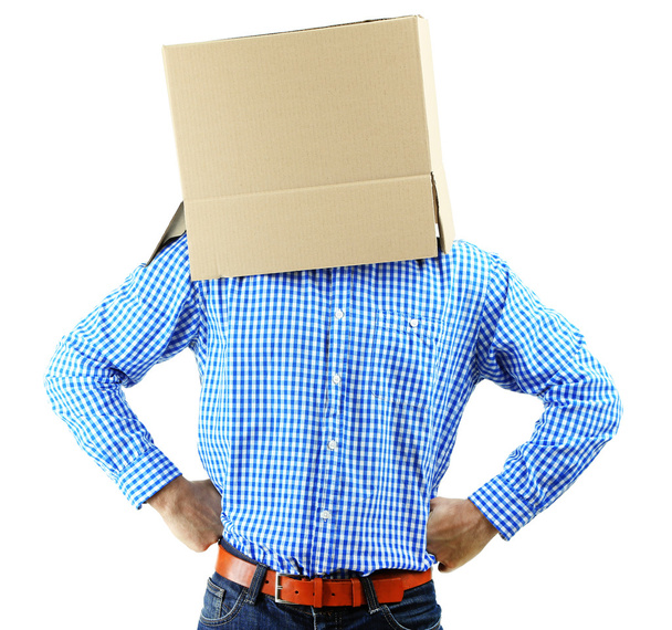 Man with cardboard box on his head isolated on white - Fotó, kép