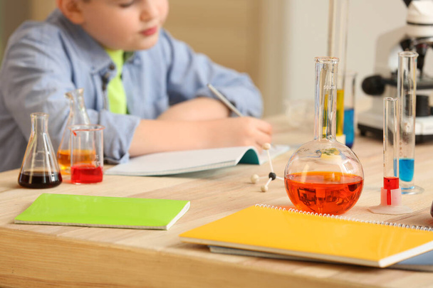 Laboratory glassware on table in classroom - Фото, изображение