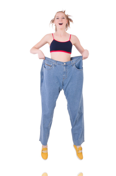 Woman with large jeans in dieting concept - Zdjęcie, obraz