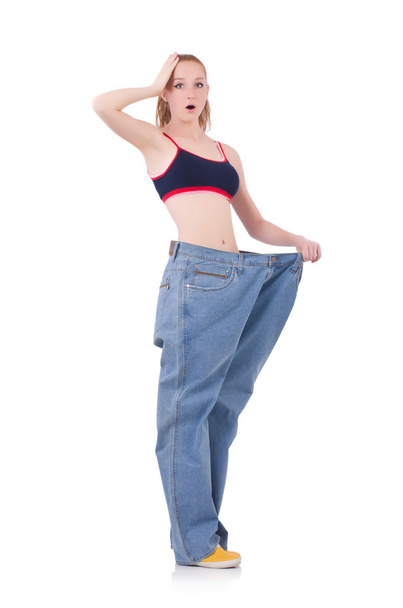 Woman with large jeans in dieting concept - Foto, imagen