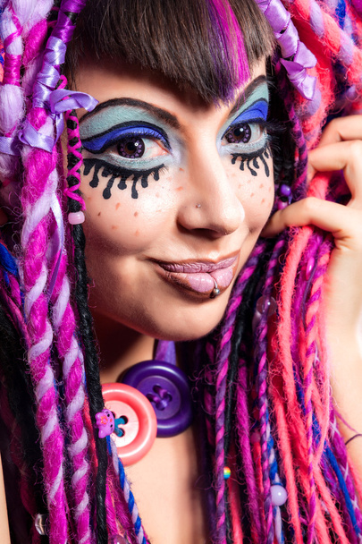 Portrait of a woman with multicolored dreadlocks and stylish mak - Zdjęcie, obraz