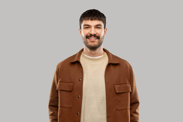 portrait of happy smiling young man with mustaches - Fotoğraf, Görsel
