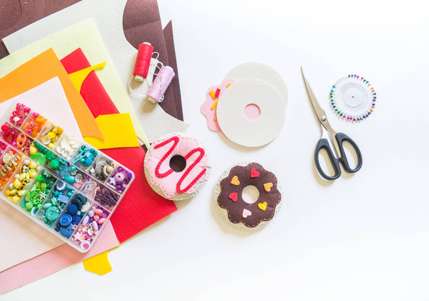 Donuts made of felt. Craft for children. A toy for a child. Material for creativity - Fotó, kép