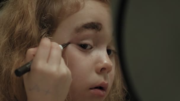 Cheerful child with sister in dresses make each other make-up. - Footage, Video
