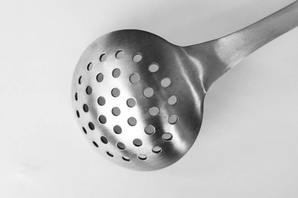 A Strainer Spoon on a White Background in isolation. - Фото, изображение