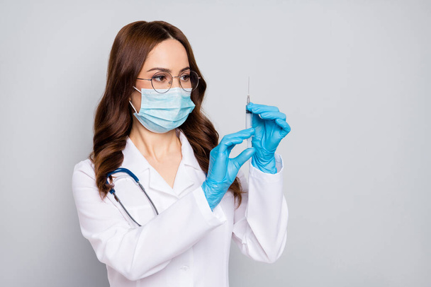 Close-up portrait of her she nice attractive wavy-haired doc surgeon nurse phonendoscope stethoscope making shot clinic hospital procedure isolated over grey pastel color background - Foto, Imagem