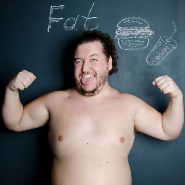 Diet and healthy lifestyle. Funny fat guy. - Фото, изображение