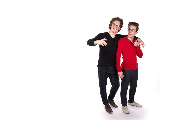 Two funny students. White background. - Foto, imagen