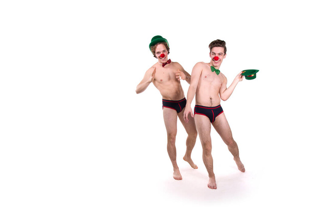 Holidays. Two funny young guys. White background. - Foto, Imagen