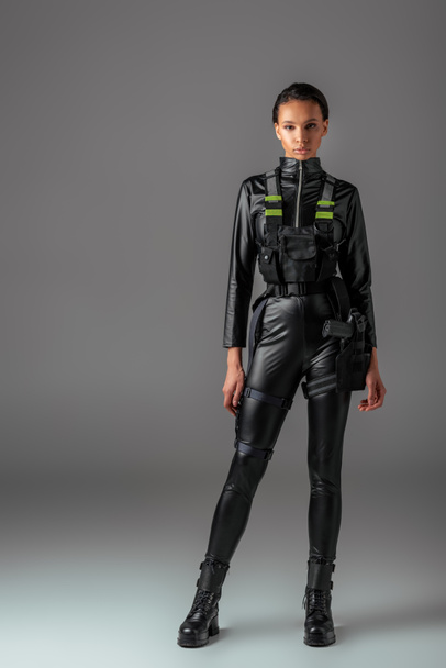 young attractive futuristic african american woman on grey - Valokuva, kuva