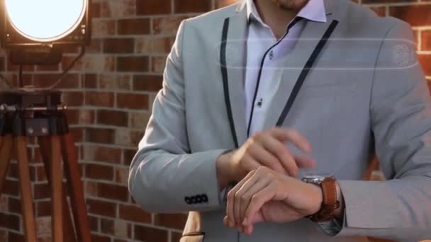 Man uses smartwatch hologram sign EUR - Záběry, video