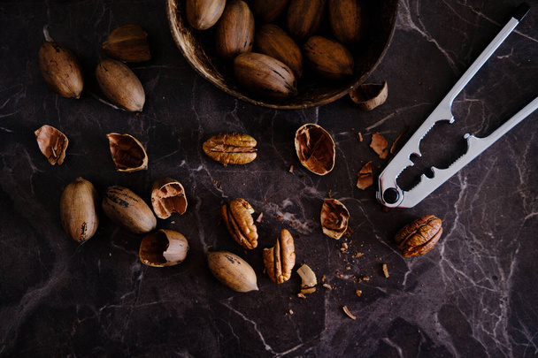 Fresh Pecan Nuts with husks - Photo, image