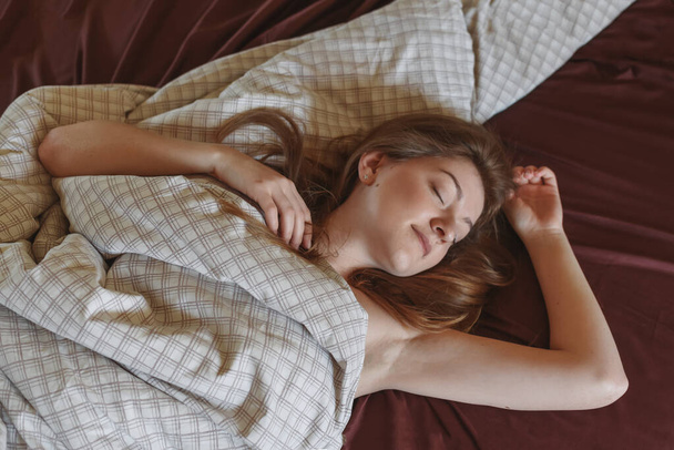 Girl woke up in bed - Фото, изображение