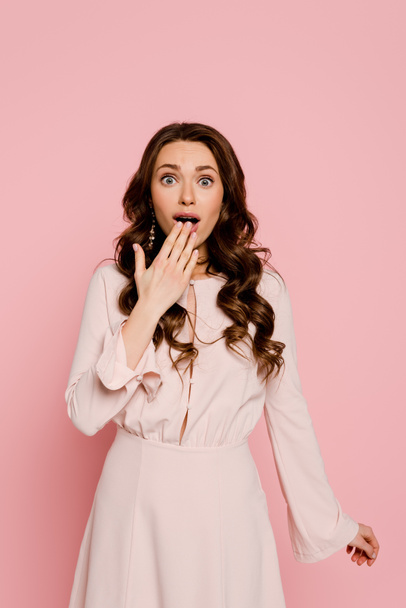 shocked girl covering mouth isolated on pink  - Photo, Image