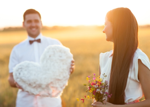 happy couple on sunset with heart in hands, conception of love, - Фото, изображение