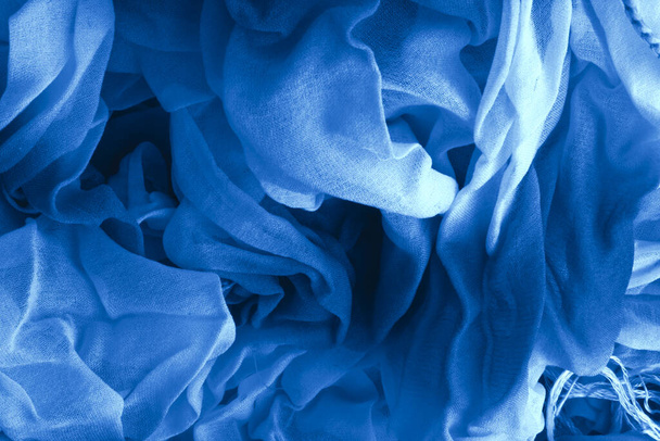 Texture of classic blue Wrinkled Fabric. Trendy color of clothes. Close-up. - Fotografie, Obrázek