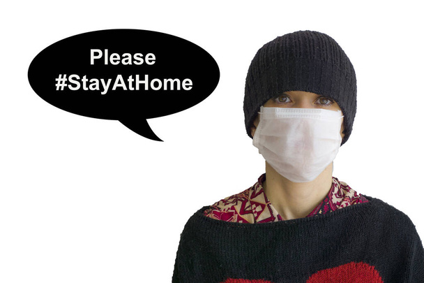 Young woman protecting herself from Corona virus (covid 19) with a mask on white background and warning people to stay at home. Girl wearing a mask for potential cold viral risks.  - Photo, Image