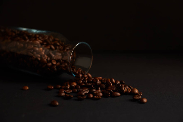 Roasted coffee beans in a glass jar - Фото, зображення