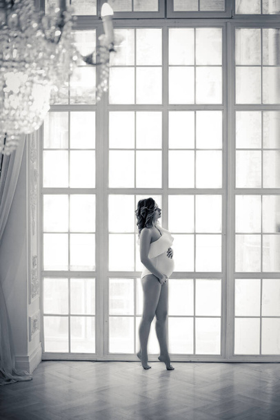 Portrait of pregnant woman in bodysuit - Fotó, kép