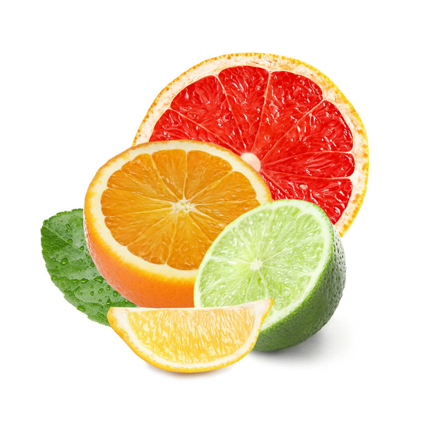 Different citrus fruits with leaves on white background  - Photo, Image