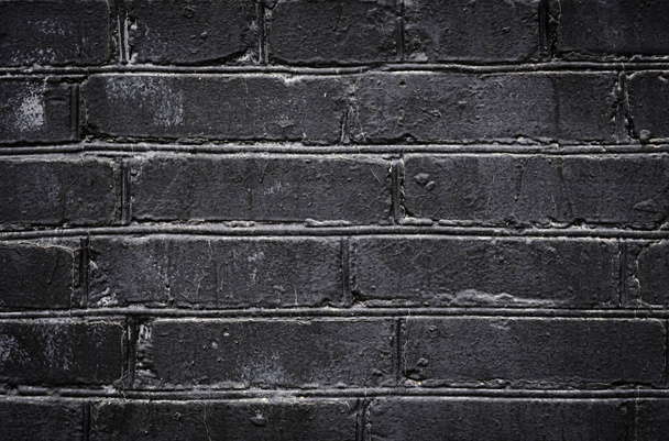 Old black painted brick wall texture or background. High contrast and resolution image with place for text. Template for design - Fotografie, Obrázek