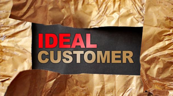 Ideal customer words under torn foil paper. Marketing research concept. - Photo, Image