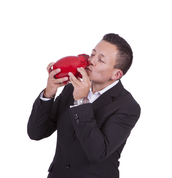 zakenman zoenen zijn piggy bank - Foto, afbeelding