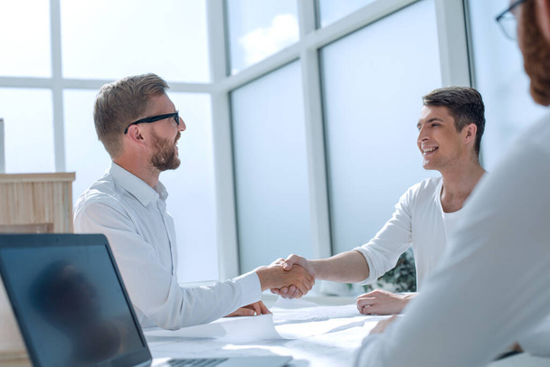 business people shaking hands in a bright office. - Photo, Image