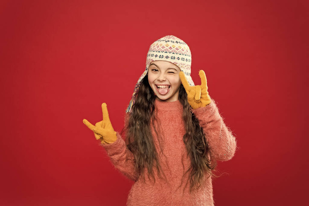 Feeling cool. Adorable baby long hair wear cute winter knitted hat. Girl wear winter theme accessory. Fun and joy. Festive spirit. Cheerful smiling kid. Playful cutie. Winter care for long hair - Photo, image